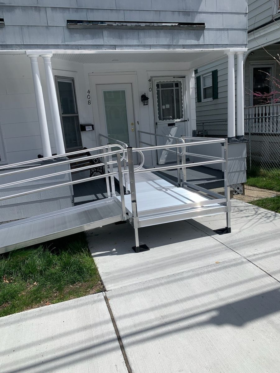 an EZ-ACCESS wheelchair ramp to the front door of a home in Brockton Massachusetts